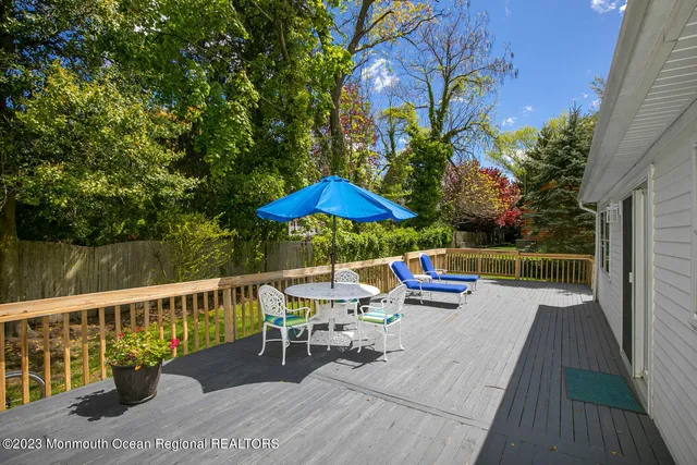 swimming pool view with a seating space