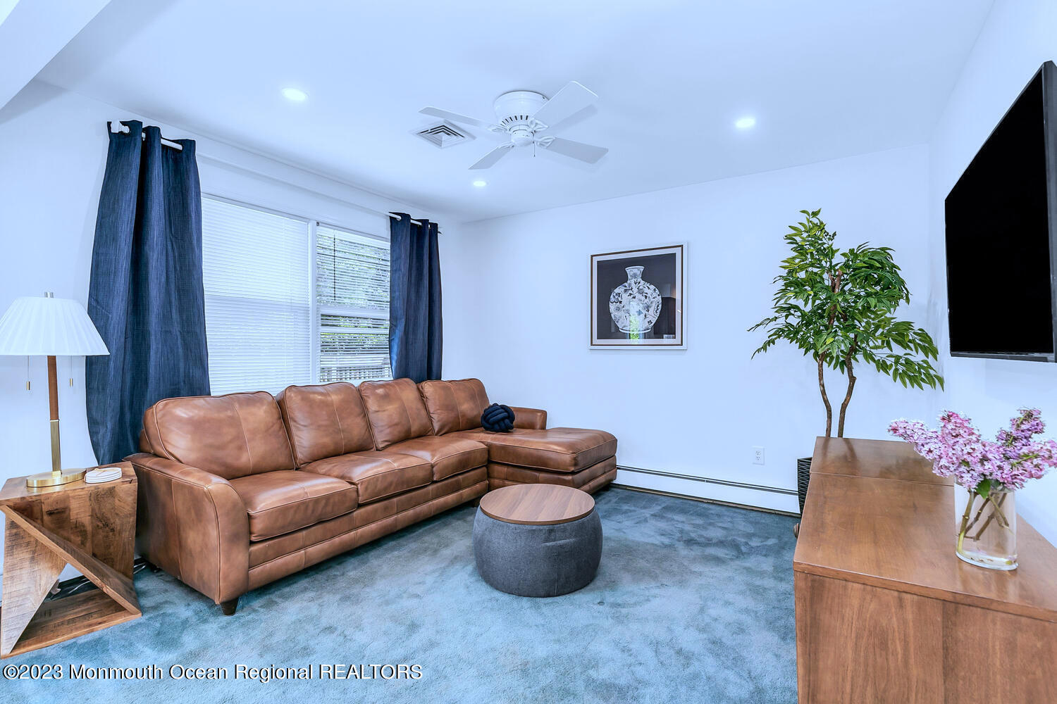 1812 Beverly Avenue Spring Lake Heights, NJ 07762 - Photo 4 of 18 a living room with furniture and a flat screen tv