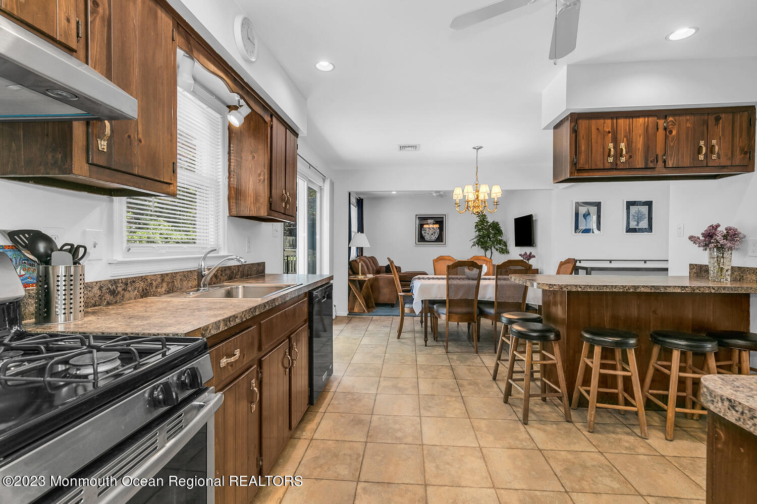 1812 Beverly Avenue Spring Lake Heights, NJ 07762 - Photo 6 of 18 a large kitchen with lots of counter space and dining table chairs