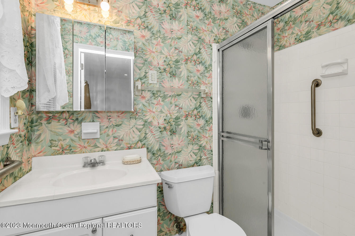 1812 Beverly Avenue Spring Lake Heights, NJ 07762 - Photo 9 of 18 a bathroom with a sink toilet and shower