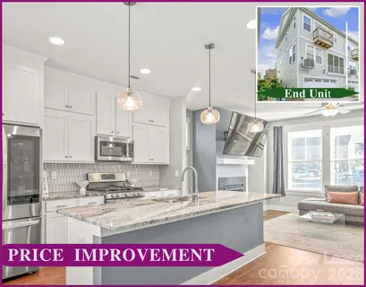 a kitchen with kitchen island granite countertop a stove a sink and a wooden floor