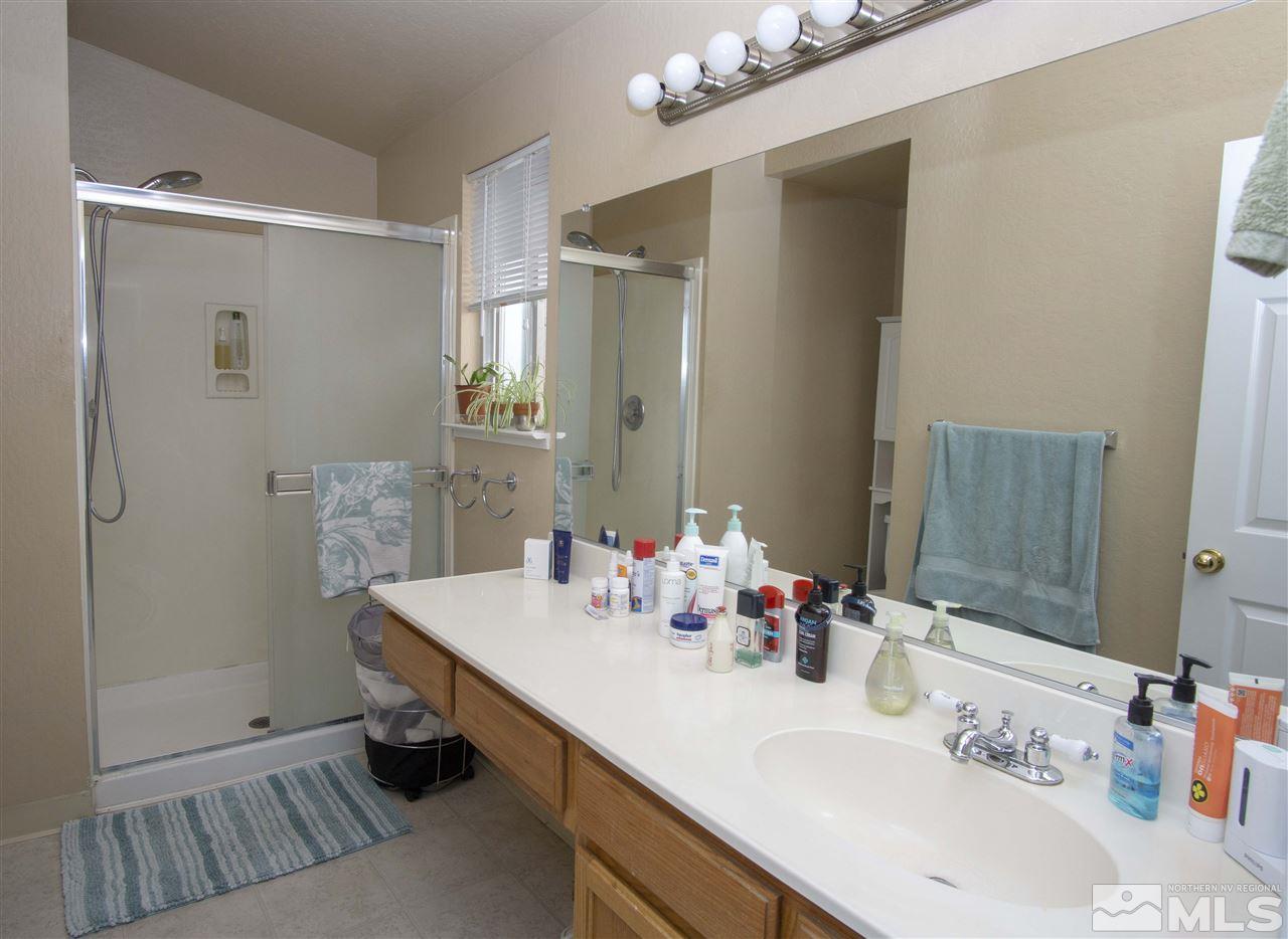 1067 Embassy Way Reno, NV 89523 - Photo 12 of 18 a bathroom with a sink and a mirror