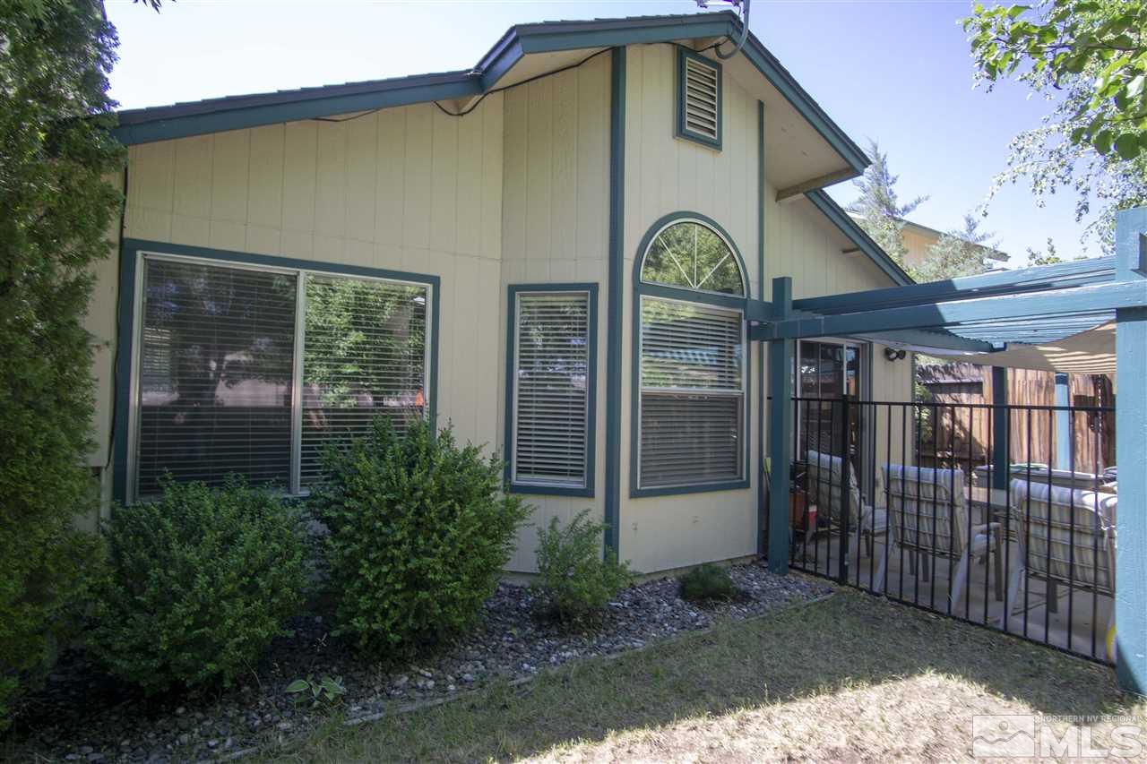 1067 Embassy Way Reno, NV 89523 - Photo 15 of 18 a front view of a house with garden