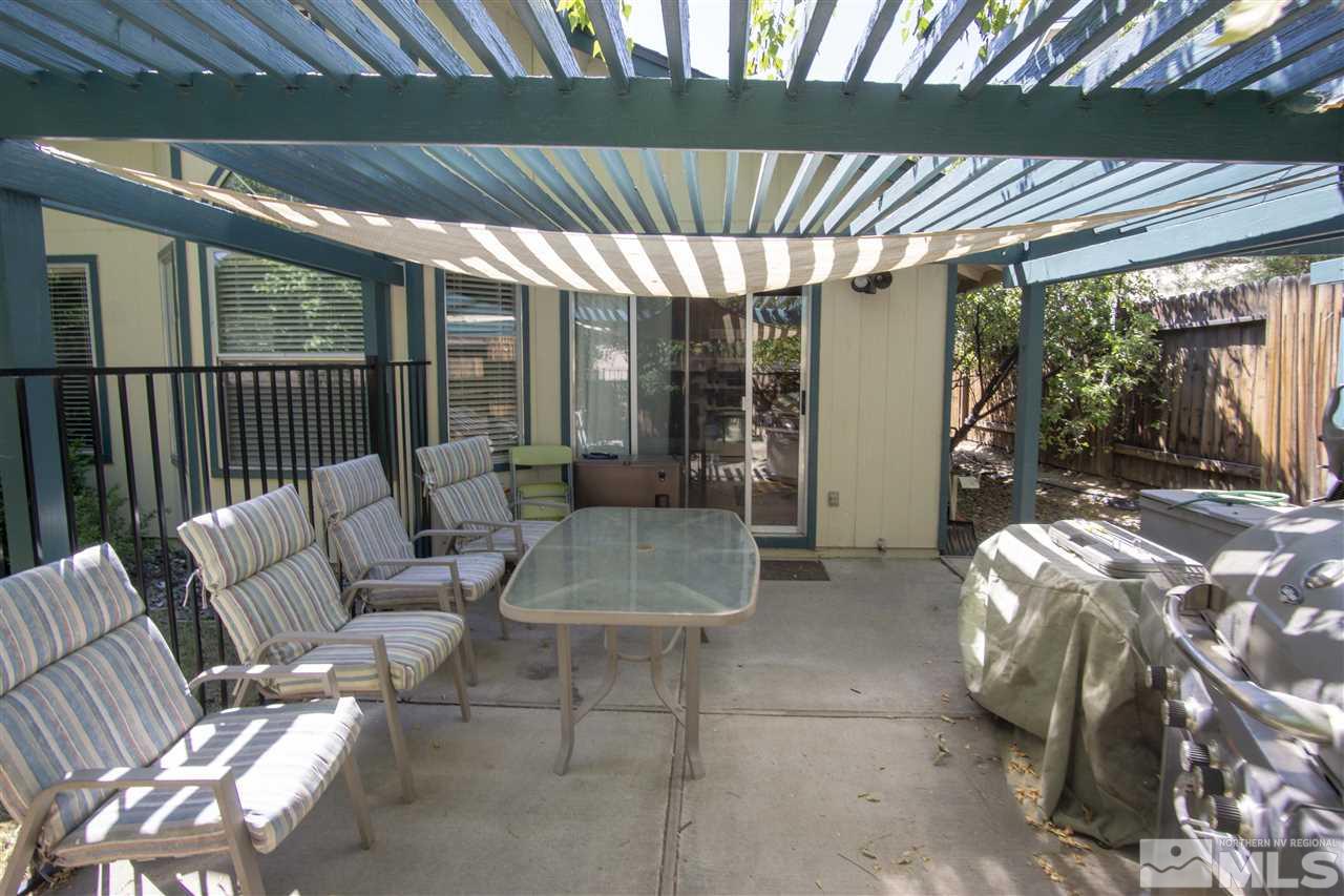 1067 Embassy Way Reno, NV 89523 - Photo 16 of 18 a balcony with furniture and a potted plant
