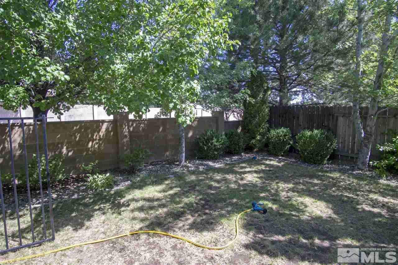 1067 Embassy Way Reno, NV 89523 - Photo 18 of 18 a backyard of a house with lots of green space