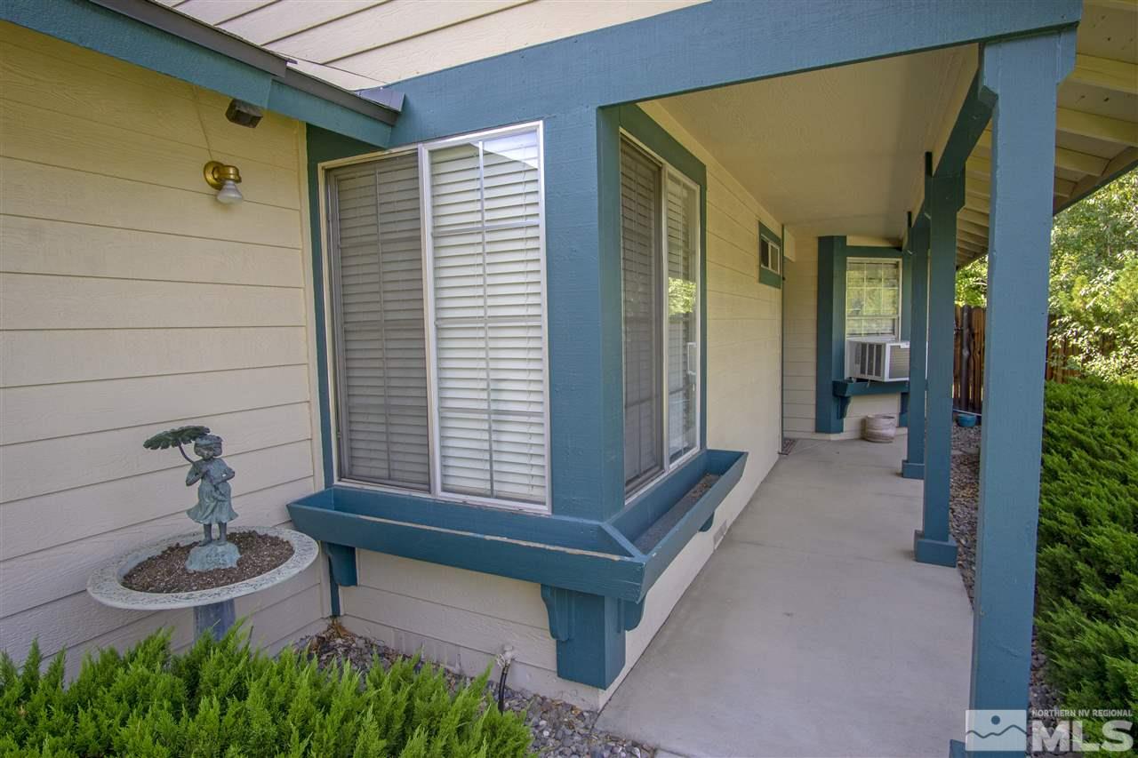 1067 Embassy Way Reno, NV 89523 - Photo 3 of 18 a view of house with backyard and outdoor seating