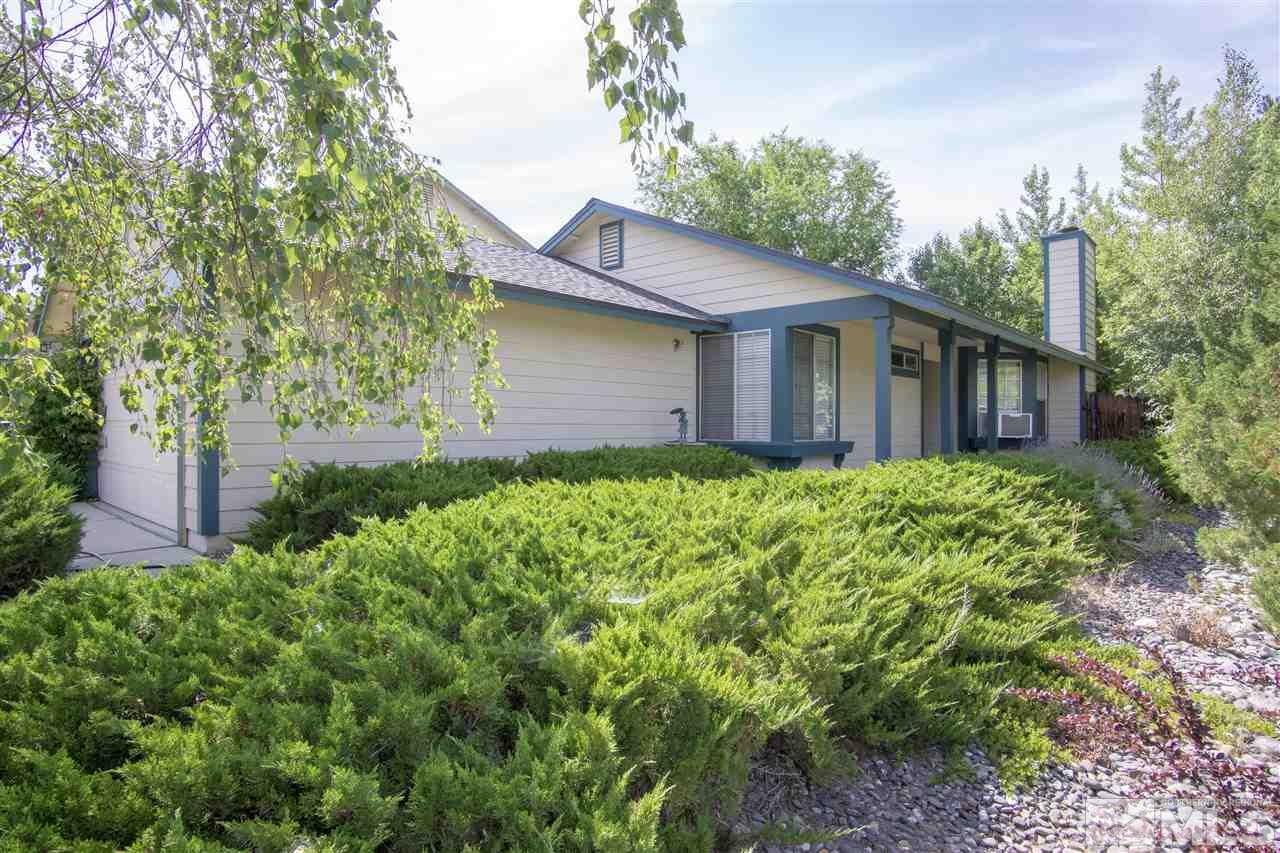 1067 Embassy Way Reno, NV 89523 - Photo 4 of 18 a view of a house with a small yard and plants
