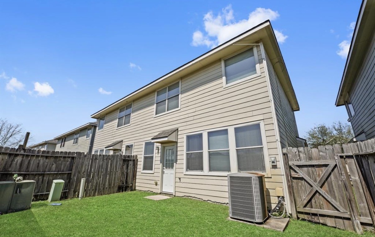 13134 Peppergate Lane Houston, TX 77044 - Photo 21 of 23 a front view of a house with a yard