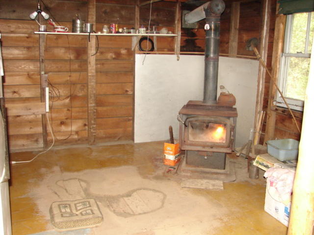 879 Northfield Road Machias, ME 04654 - Photo 3 of 4 Earl Flathery inside camp stove