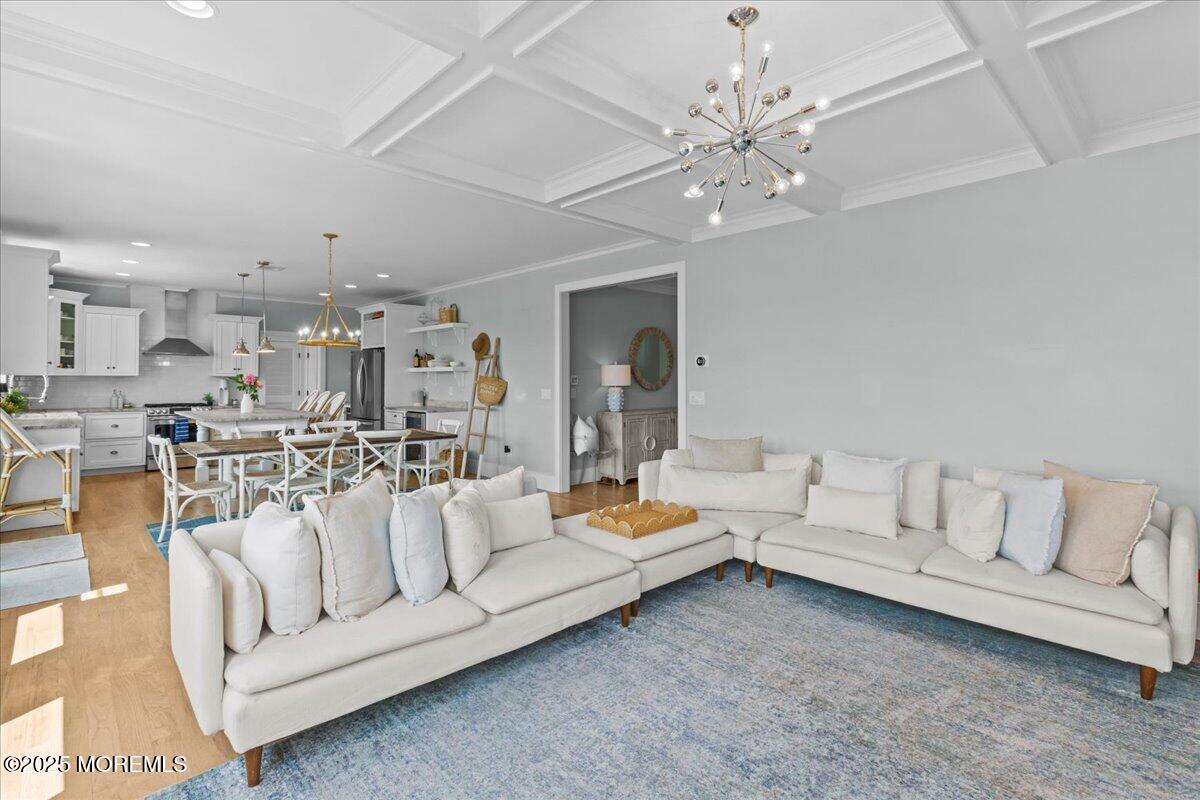 1730 Rue Mirador, Unit WINTER MONTHLY RENTAL Point Pleasant, NJ 08742 - Photo 18 of 72 a living room with furniture and a chandelier