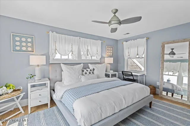 a bathroom with double sink and a mirror