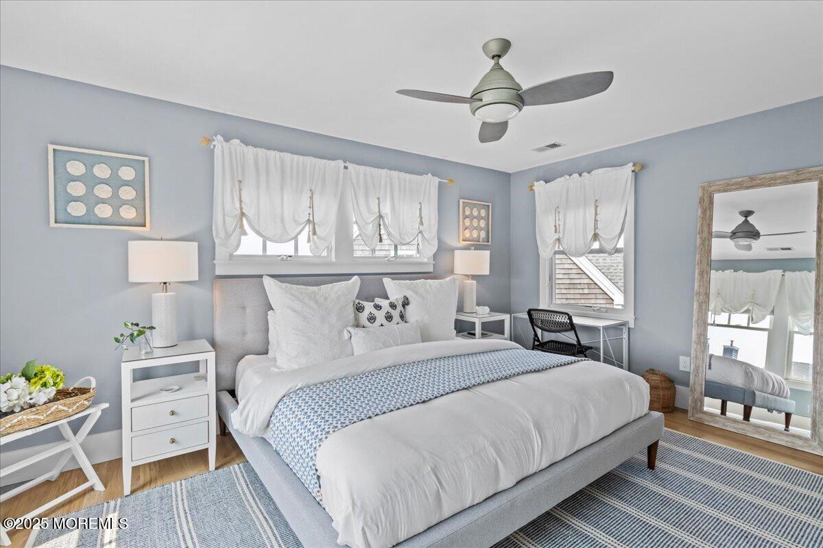 1730 Rue Mirador, Unit WINTER MONTHLY RENTAL Point Pleasant, NJ 08742 - Photo 21 of 72 a bedroom with a bed and a table in it