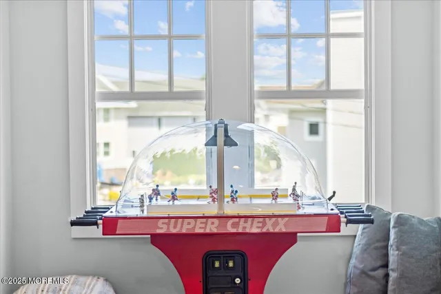 a view of an entryway with wooden floor and cabinet