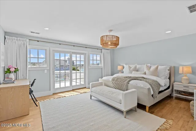 a bathroom with double vanity sinks and a bathtub