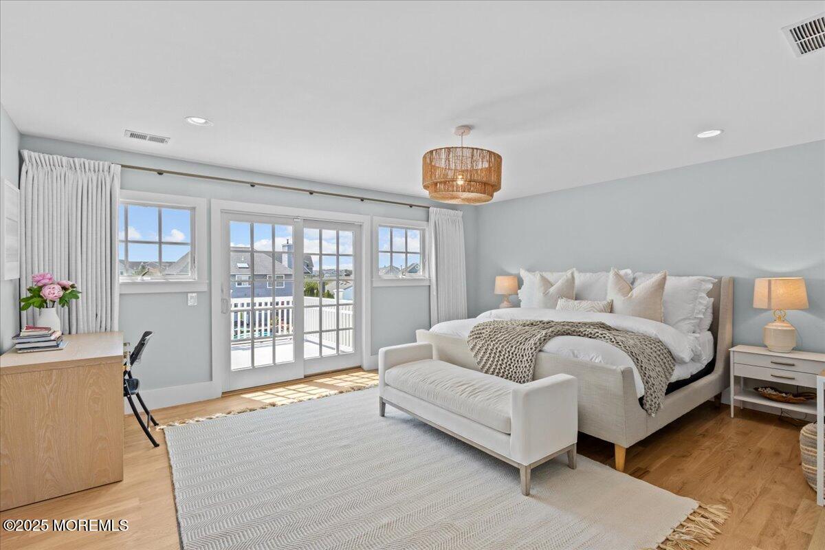 1730 Rue Mirador, Unit WINTER MONTHLY RENTAL Point Pleasant, NJ 08742 - Photo 30 of 72 a spacious bedroom with a bed and a large window