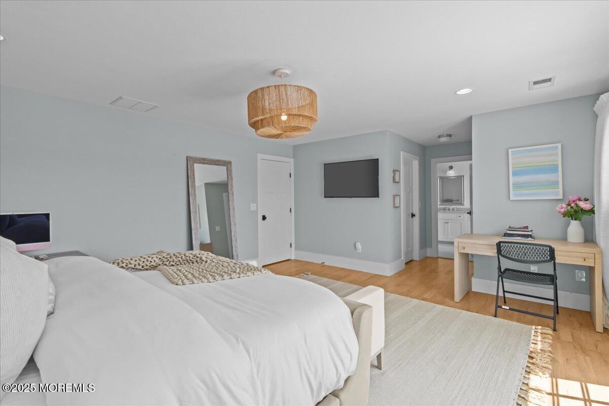 1730 Rue Mirador, Unit WINTER MONTHLY RENTAL Point Pleasant, NJ 08742 - Photo 32 of 72 a bedroom with a bed and furniture