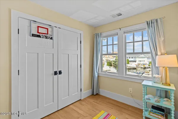 a view of a room with furniture and wooden floor