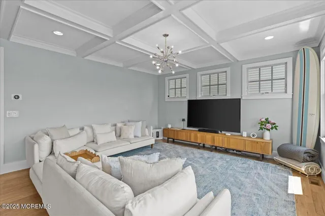 a kitchen with cabinets and wooden floor