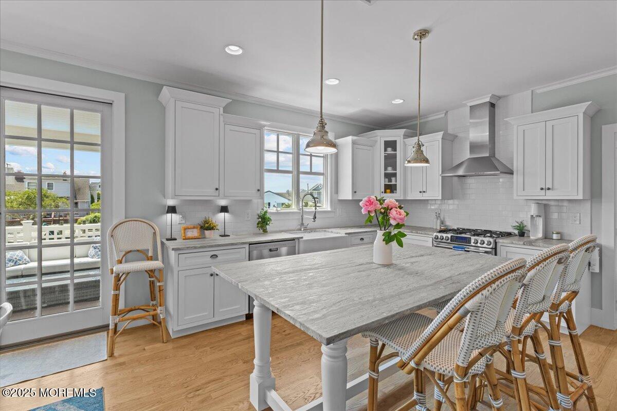 1730 Rue Mirador, Unit WINTER MONTHLY RENTAL Point Pleasant, NJ 08742 - Photo 8 of 72 a kitchen with stainless steel appliances granite countertop stove top oven and cabinets