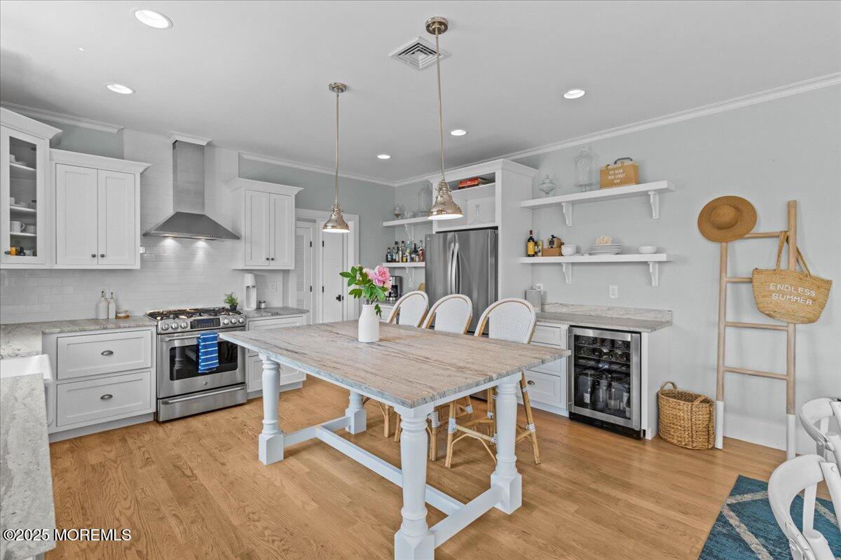 1730 Rue Mirador, Unit WINTER MONTHLY RENTAL Point Pleasant, NJ 08742 - Photo 9 of 72 a kitchen with cabinets and wooden floor