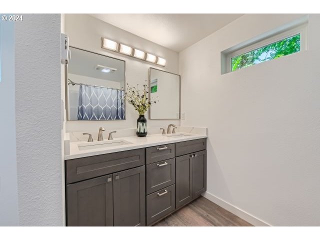 20064 South Central Point Road Oregon City, OR 97045 - Photo 17 of 34 a bathroom with a double vanity sink and mirror