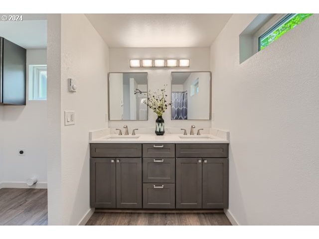 20064 South Central Point Road Oregon City, OR 97045 - Photo 18 of 34 a bathroom with a double vanity sink and a mirror