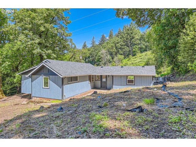 20064 South Central Point Road Oregon City, OR 97045 - Photo 3 of 34 a house view with a garden space