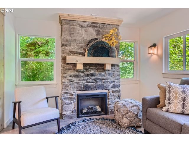 20064 South Central Point Road Oregon City, OR 97045 - Photo 7 of 34 a living room with furniture and a fireplace
