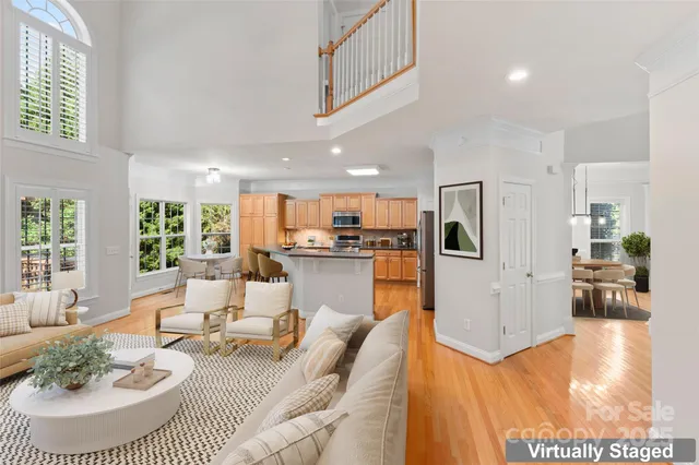 a kitchen with stainless steel appliances granite countertop a sink a stove and a refrigerator