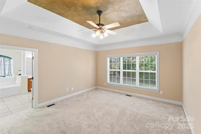 a roof deck with table and chairs and wooden floor
