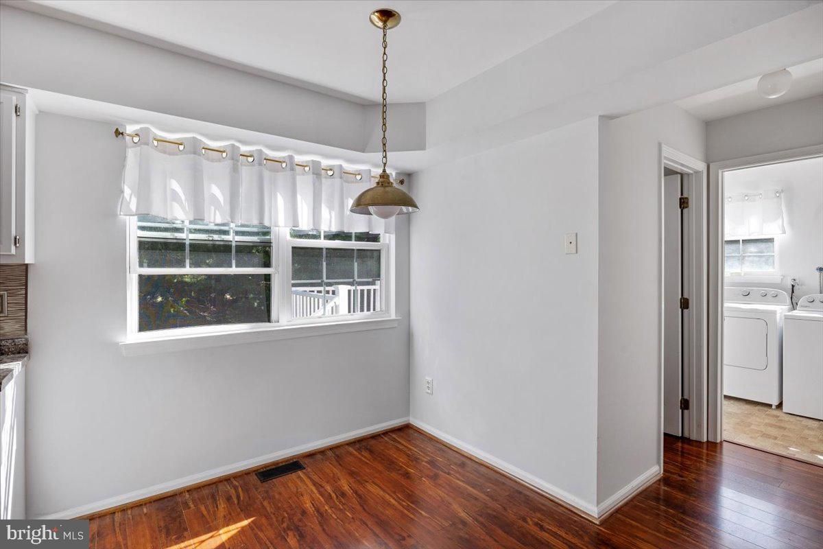 25 Country Club Road Pine Hill, NJ 08021 - Photo 11 of 40 a view of an empty room with wooden floor and a window
