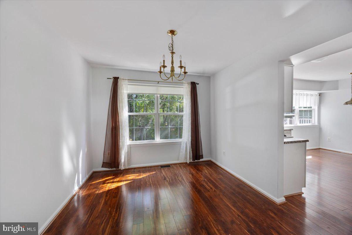 25 Country Club Road Pine Hill, NJ 08021 - Photo 14 of 40 a view of a room with wooden floor cabinets and a window