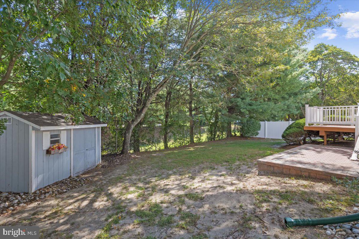 25 Country Club Road Pine Hill, NJ 08021 - Photo 34 of 40 a view of a backyard with wooden fence and large trees
