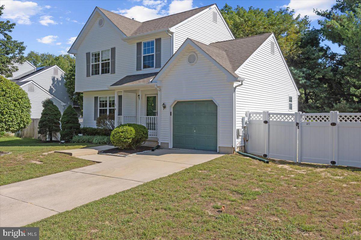 25 Country Club Road Pine Hill, NJ 08021 - Photo 4 of 40 a front view of a house with a yard and garage