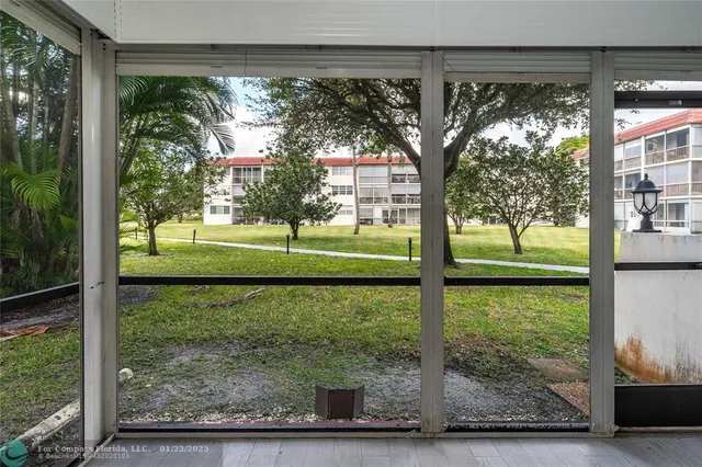 a view of a porch with a yard