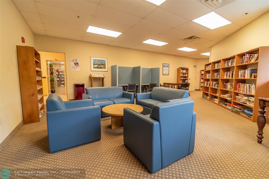 9523 South Hollybrook Lake Drive, Unit 102 Pembroke Pines, FL 33025 - Photo 58 of 63 a living room with furniture and a wooden floor