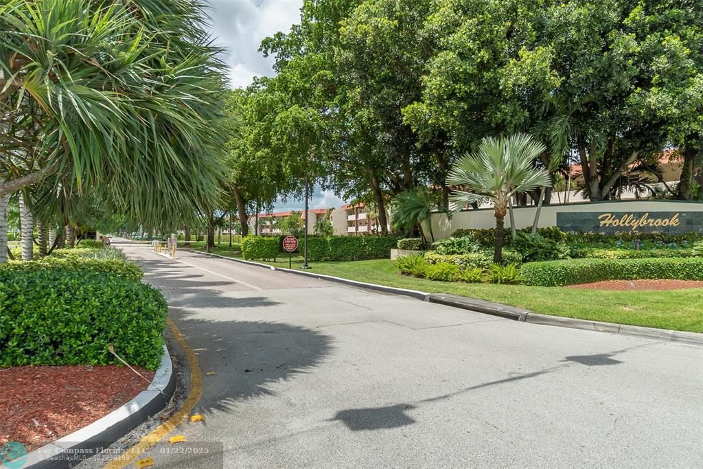 9523 South Hollybrook Lake Drive, Unit 102 Pembroke Pines, FL 33025 - Photo 62 of 63 a view of street with a yard