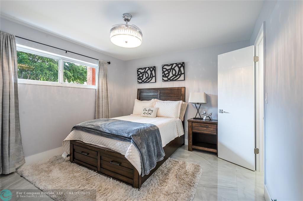 9523 South Hollybrook Lake Drive, Unit 102 Pembroke Pines, FL 33025 - Photo 7 of 63 a bedroom with a bed and window