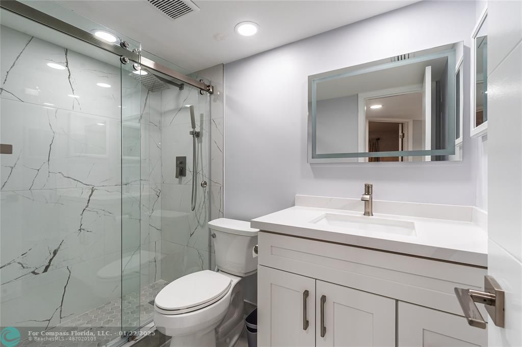 9523 South Hollybrook Lake Drive, Unit 102 Pembroke Pines, FL 33025 - Photo 8 of 63 a bathroom with a sink toilet vanity and shower