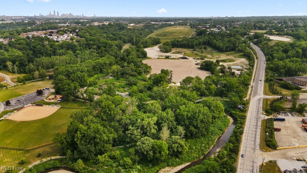 5000 Warner Road Garfield Heights, OH 44125 - Photo 24 of 41 Aerial overview of property's location featuring a tree filled landscape
