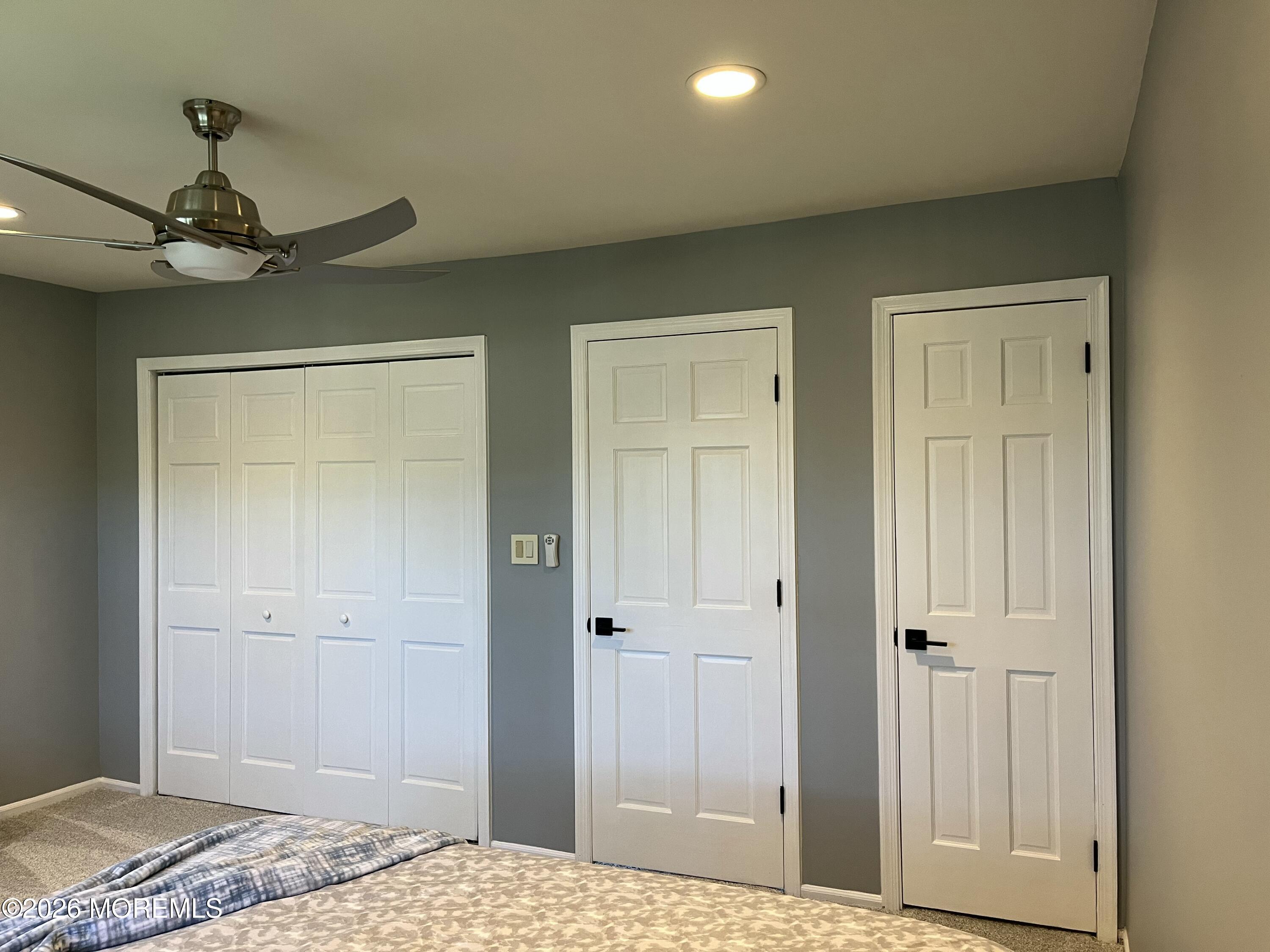 53 Primrose Lane Brick, NJ 08724 - Photo 15 of 17 a bedroom with a bed and a chandelier