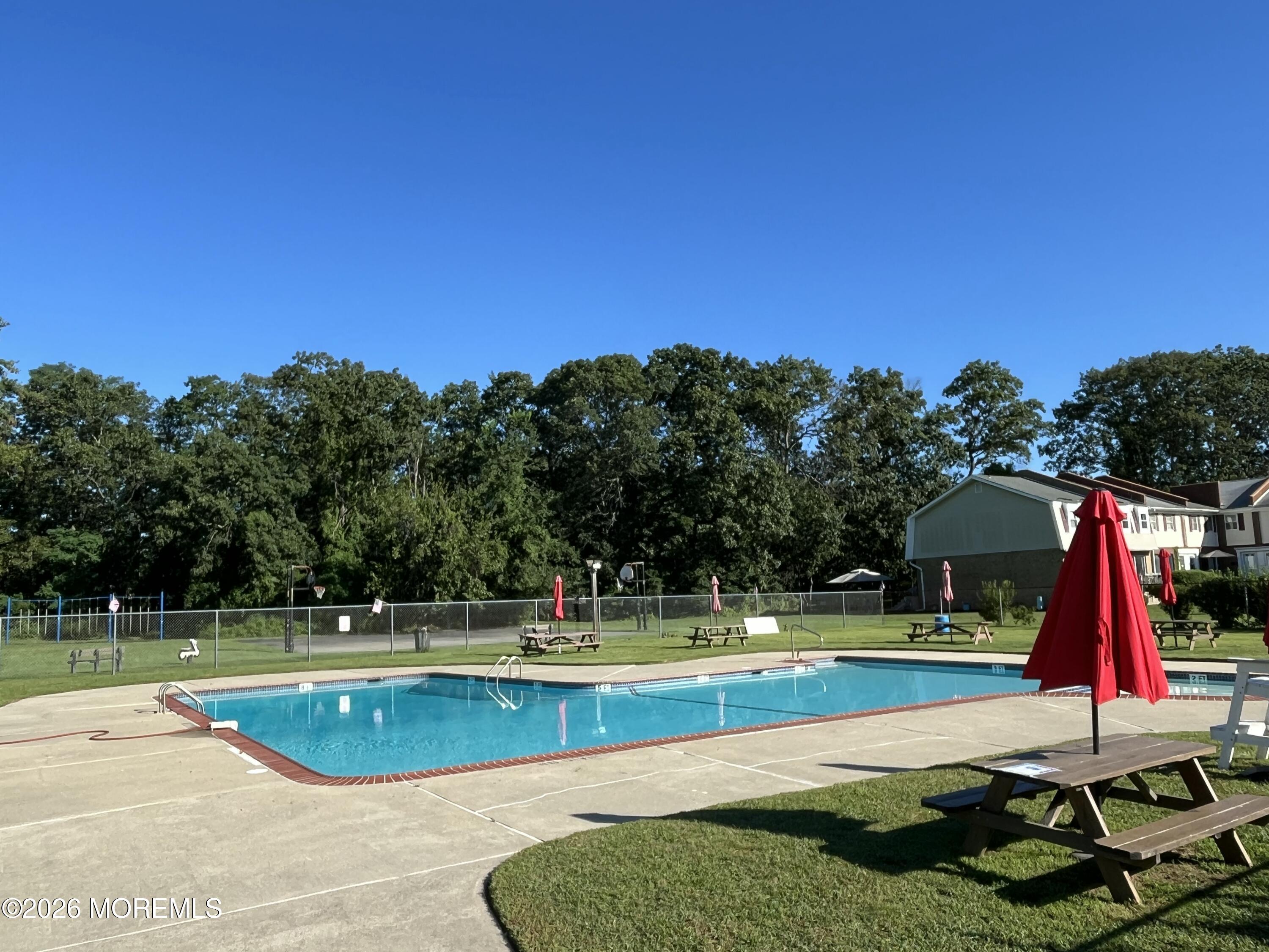 53 Primrose Lane Brick, NJ 08724 - Photo 17 of 17 a view of a swimming pool with a yard