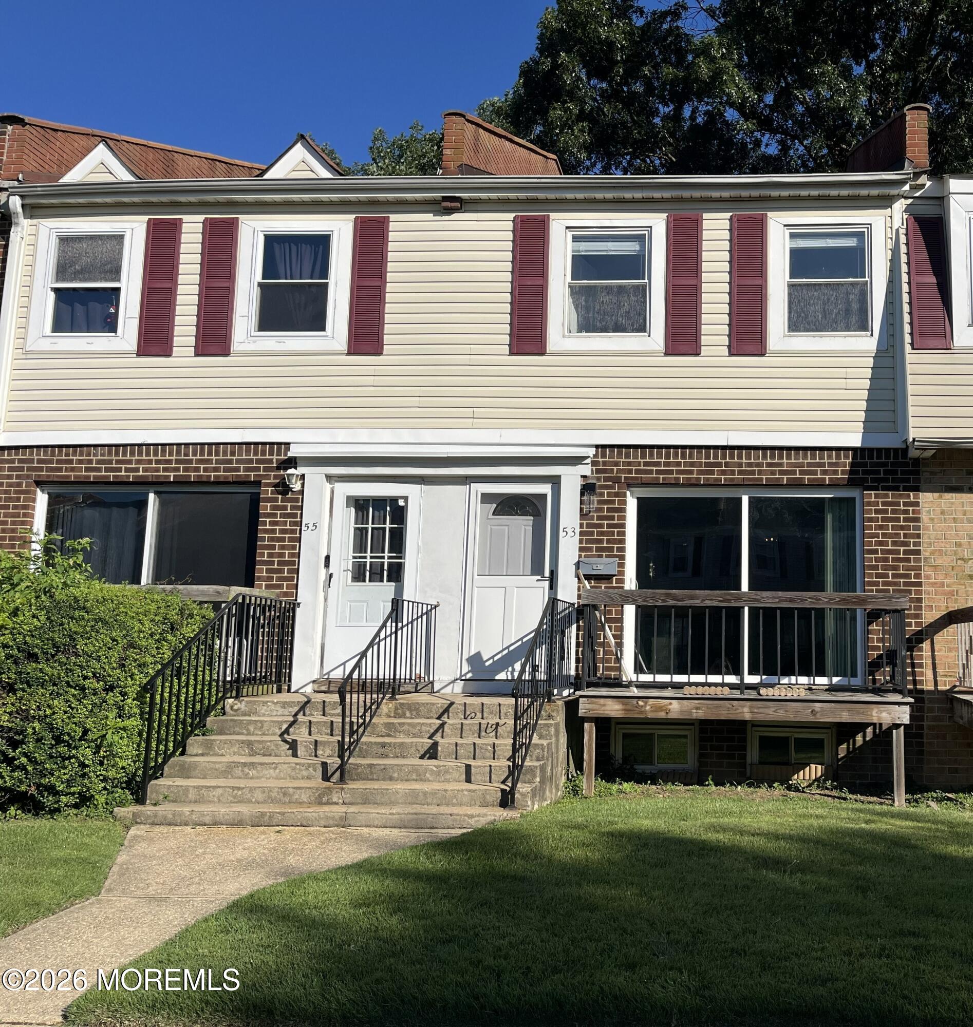 53 Primrose Lane Brick, NJ 08724 - Photo 2 of 17 a house with garden in front of it