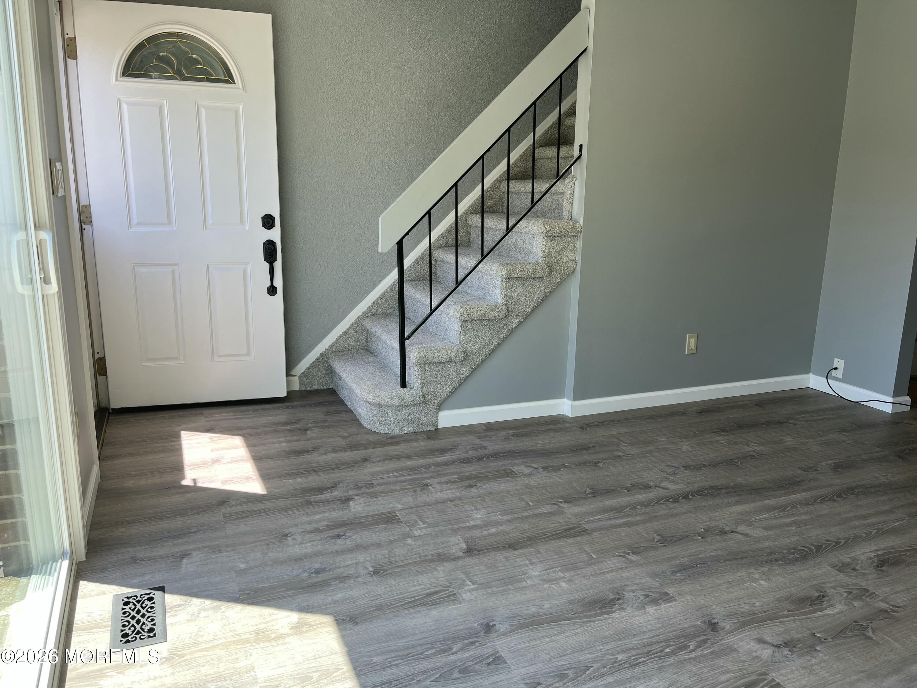 53 Primrose Lane Brick, NJ 08724 - Photo 3 of 17 a view of entryway and hall with wooden floor