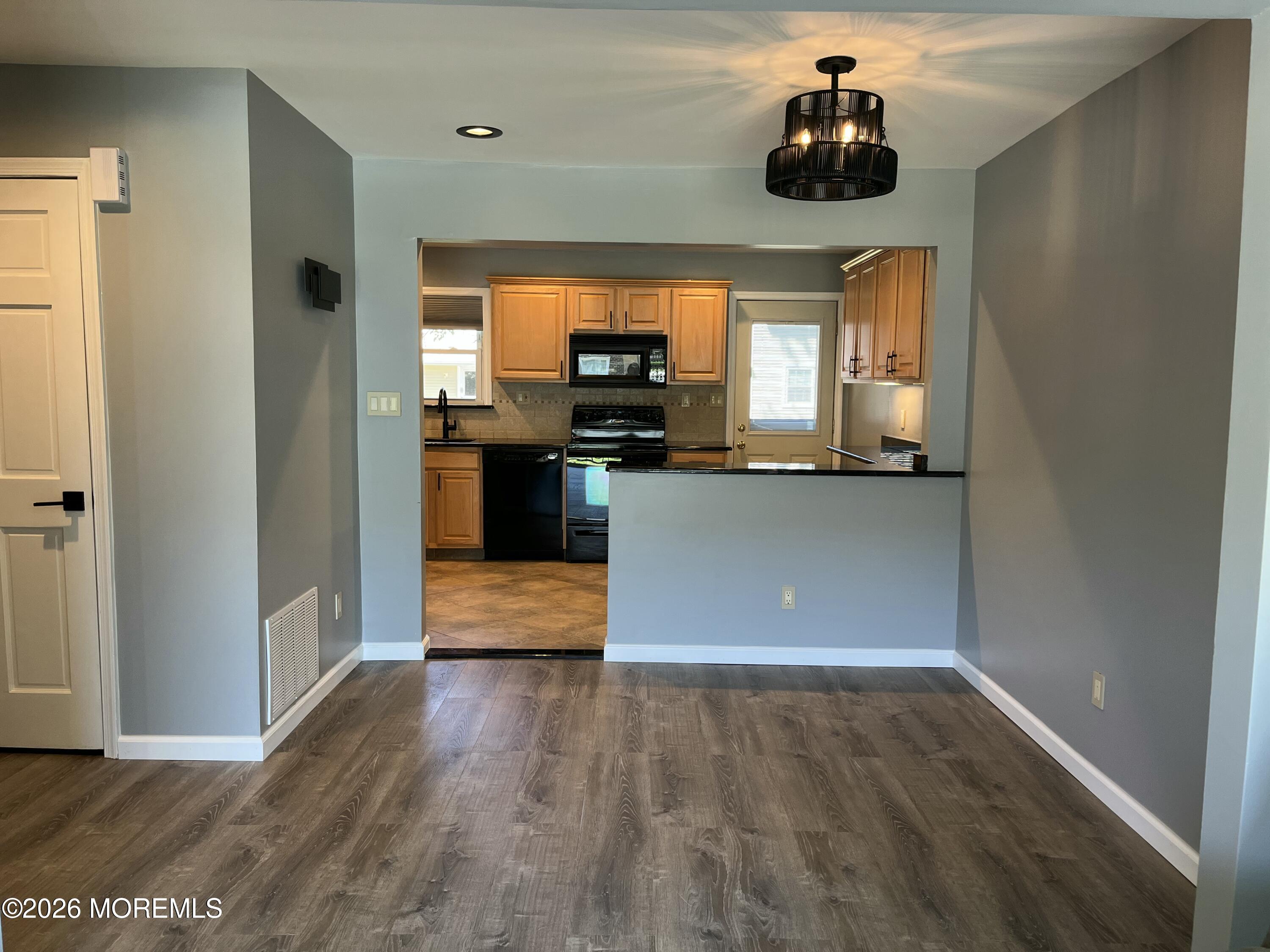 53 Primrose Lane Brick, NJ 08724 - Photo 6 of 17 a kitchen with stainless steel appliances granite countertop a stove and a refrigerator
