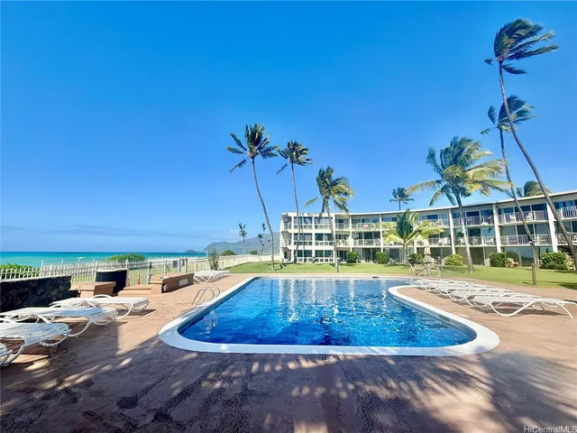 a view of a swimming pool with a patio