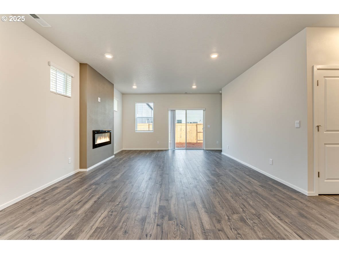 2963 U Street Springfield, OR 97477 - Photo 19 of 26 a view of empty room with wooden floor and window