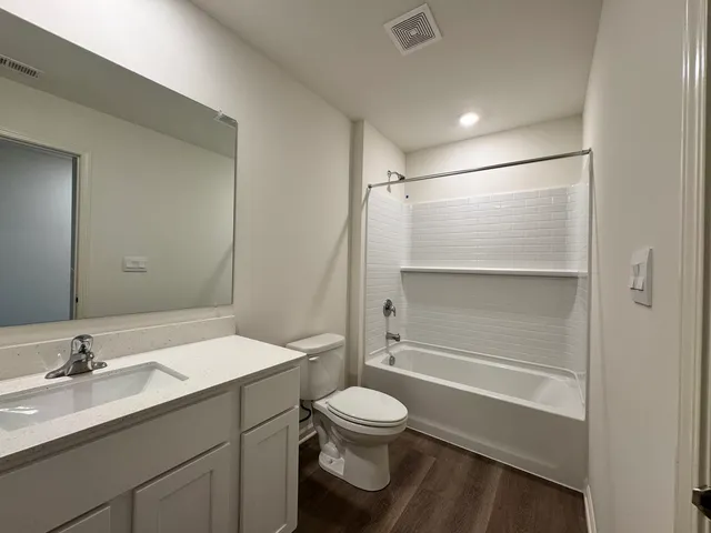 a bathroom with a toilet a sink and a bathtub