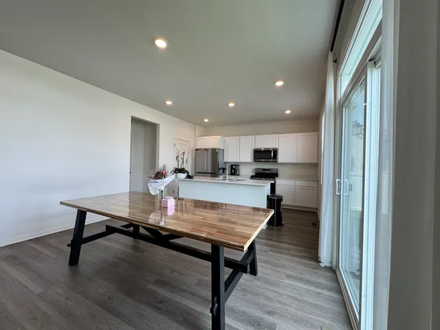 a room with kitchen table and chairs