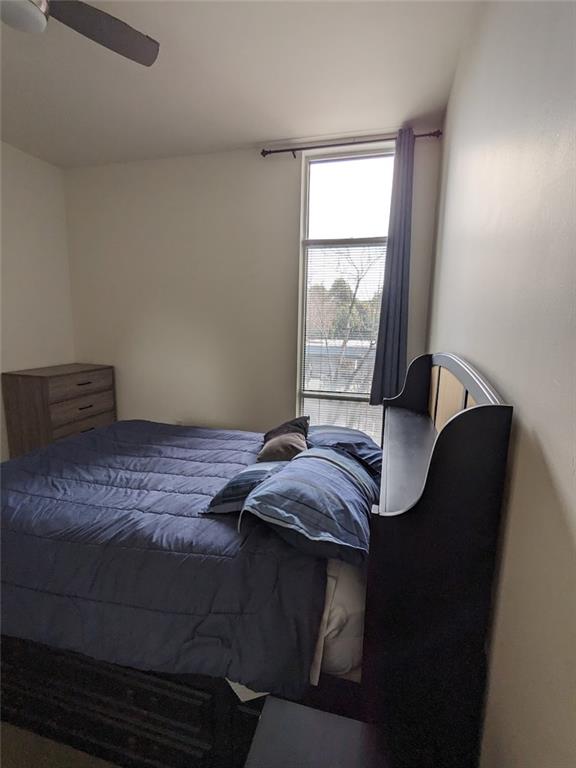 89 Mangum Street Southwest, Unit 207 Atlanta, GA 30313 - Photo 13 of 23 a bedroom with a bed and a window